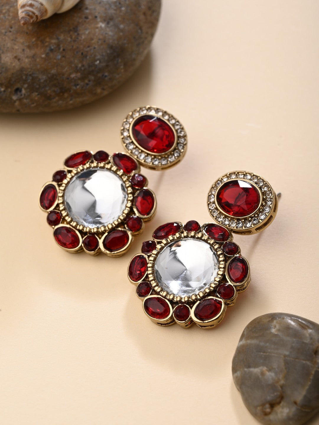 Statement earrings featuring a bold circular design with a vintage finish Red