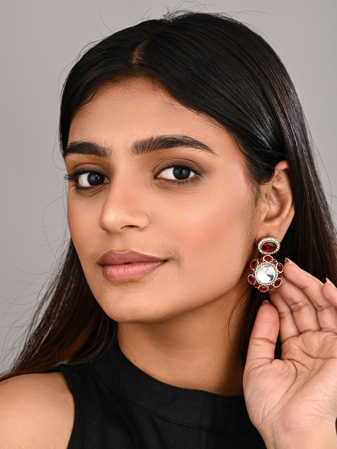 Statement earrings featuring a bold circular design with a vintage finish Red