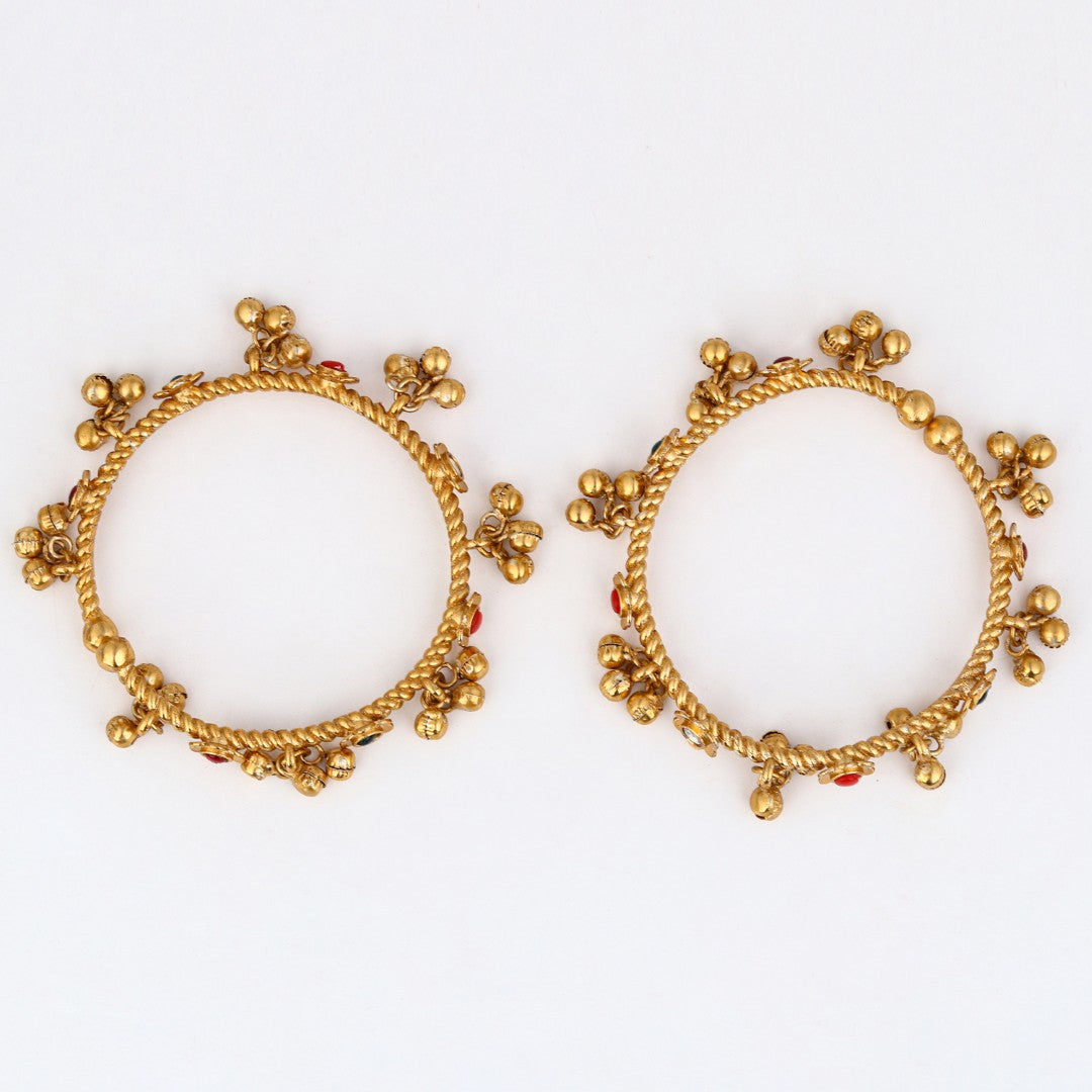 Festive Gold Ghungroo Bangles with Red Accents