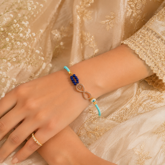 Infinity Evil Eye Lumba Rakhi with Blue Beads & Adjustable Sky Blue Thread