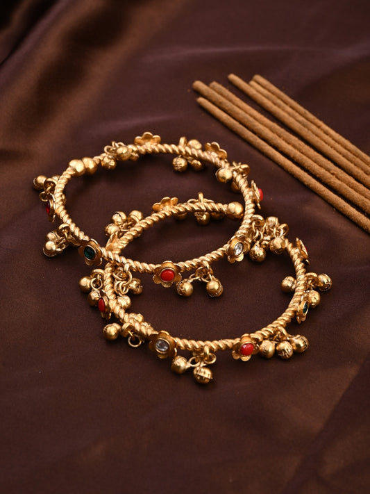 Festive Gold Ghungroo Bangles with Red Accents