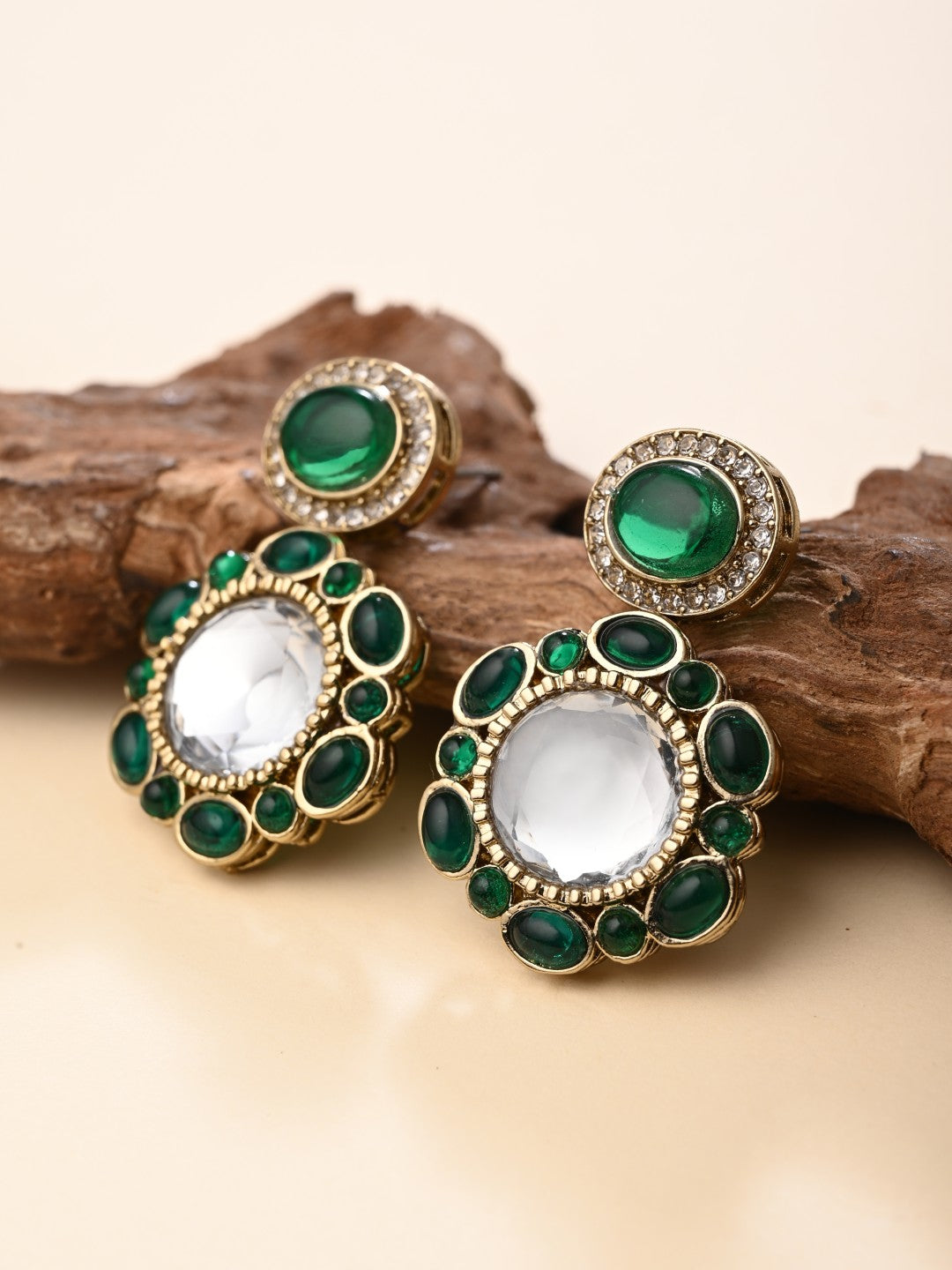 Statement earrings featuring a bold circular design with a vintage finish Green