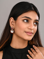 Statement earrings featuring a bold circular design with a vintage finish Red