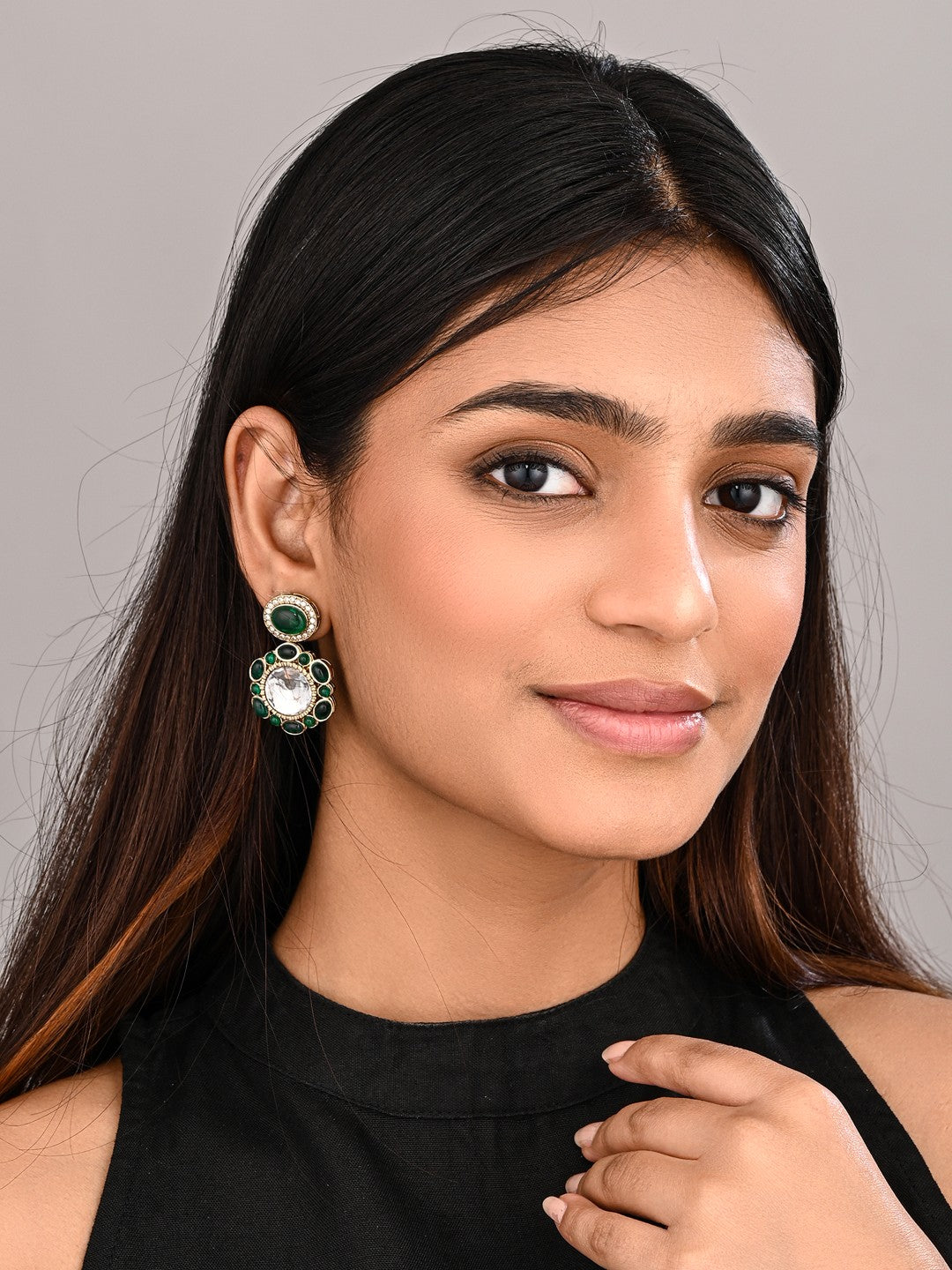 Statement earrings featuring a bold circular design with a vintage finish Green
