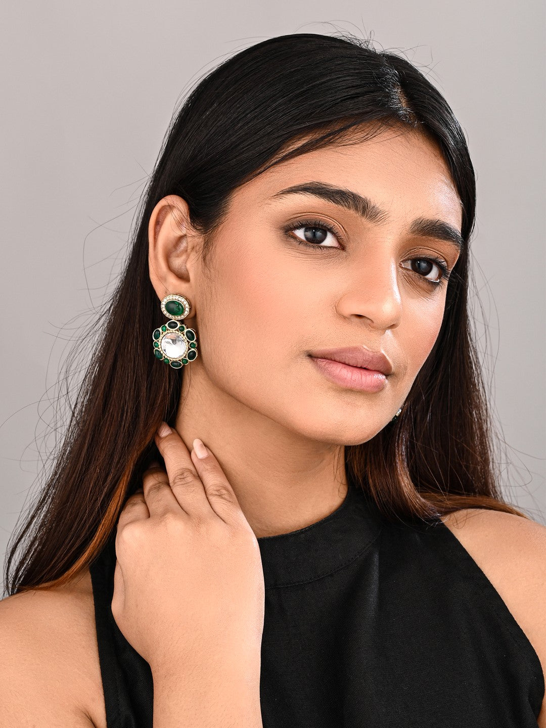 Statement earrings featuring a bold circular design with a vintage finish Green