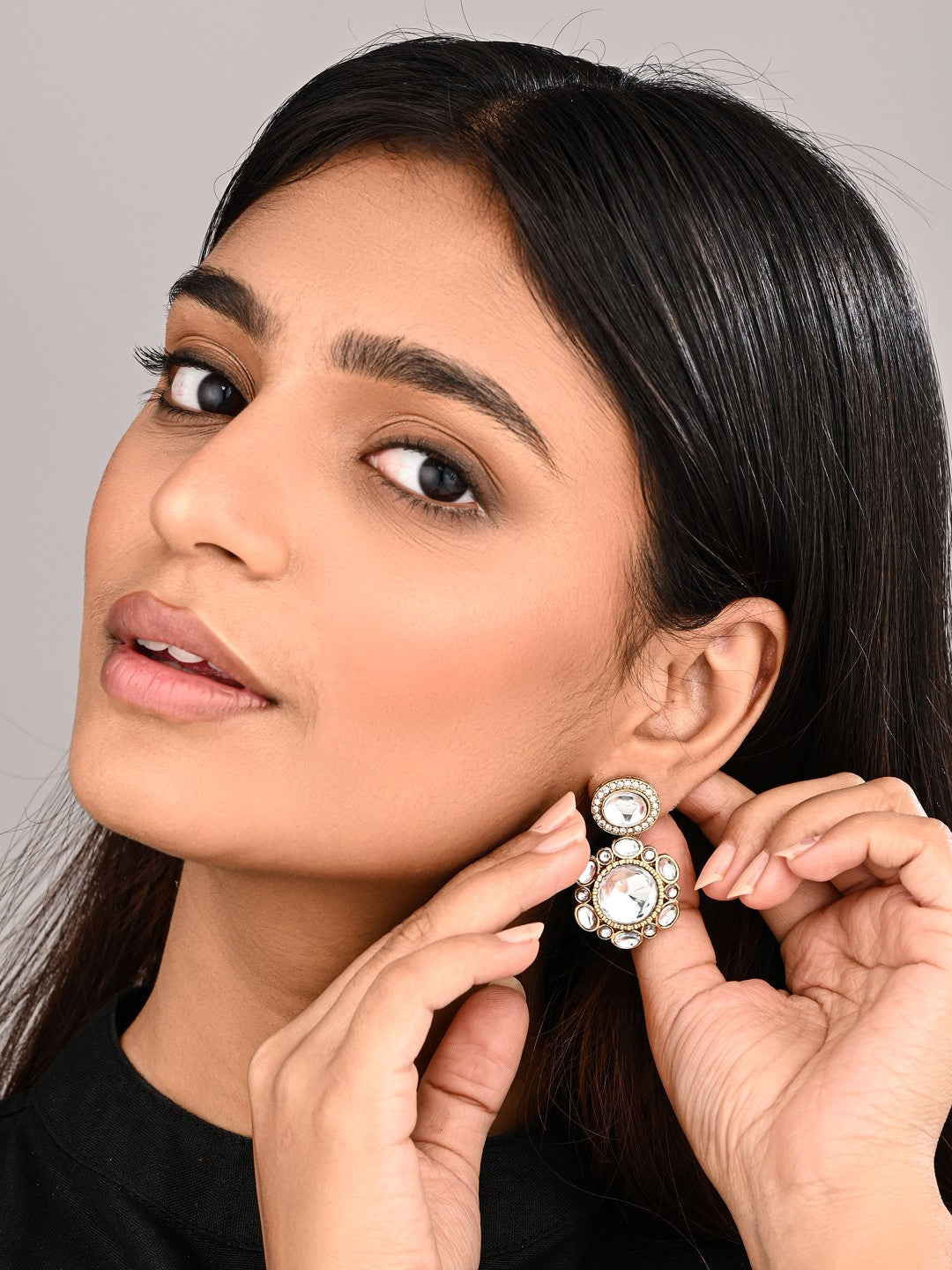 Statement earrings featuring a bold circular design with a vintage finish Gold