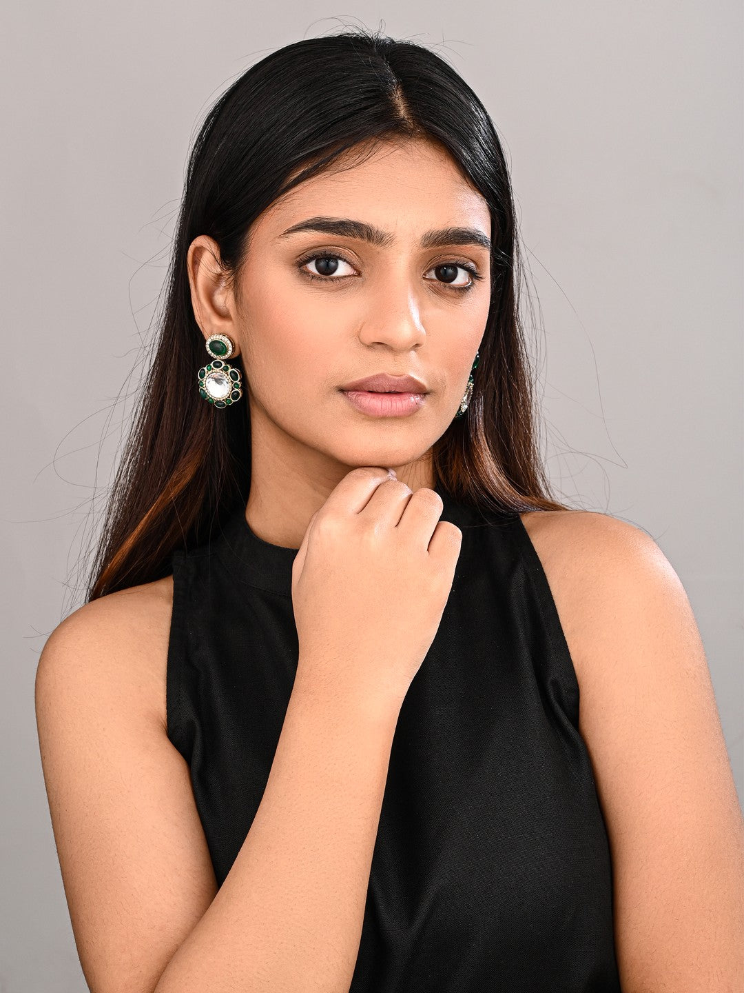 Statement earrings featuring a bold circular design with a vintage finish Green