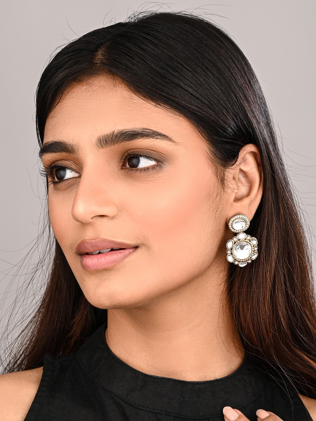 Statement earrings featuring a bold circular design with a vintage finish Gold
