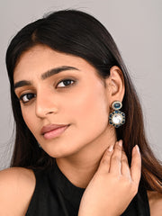 Statement earrings featuring a bold circular design with a vintage finish Blue