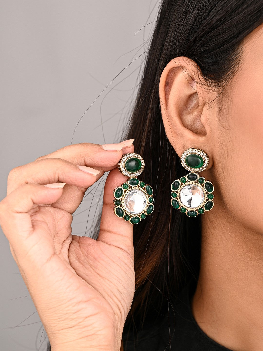 Statement earrings featuring a bold circular design with a vintage finish Green