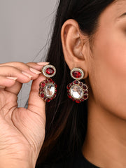 Statement earrings featuring a bold circular design with a vintage finish Red