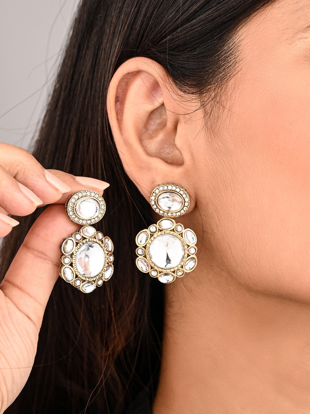 Statement earrings featuring a bold circular design with a vintage finish Gold
