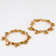 Festive Gold Ghungroo Bangles with Red Accents