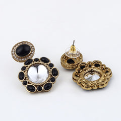 Statement earrings featuring a bold circular design with a vintage finish Black