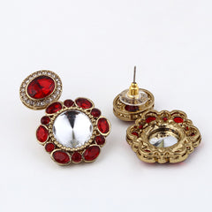 Statement earrings featuring a bold circular design with a vintage finish Red
