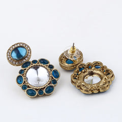 Statement earrings featuring a bold circular design with a vintage finish Blue