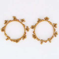 Festive Gold Ghungroo Bangles with Red Accents