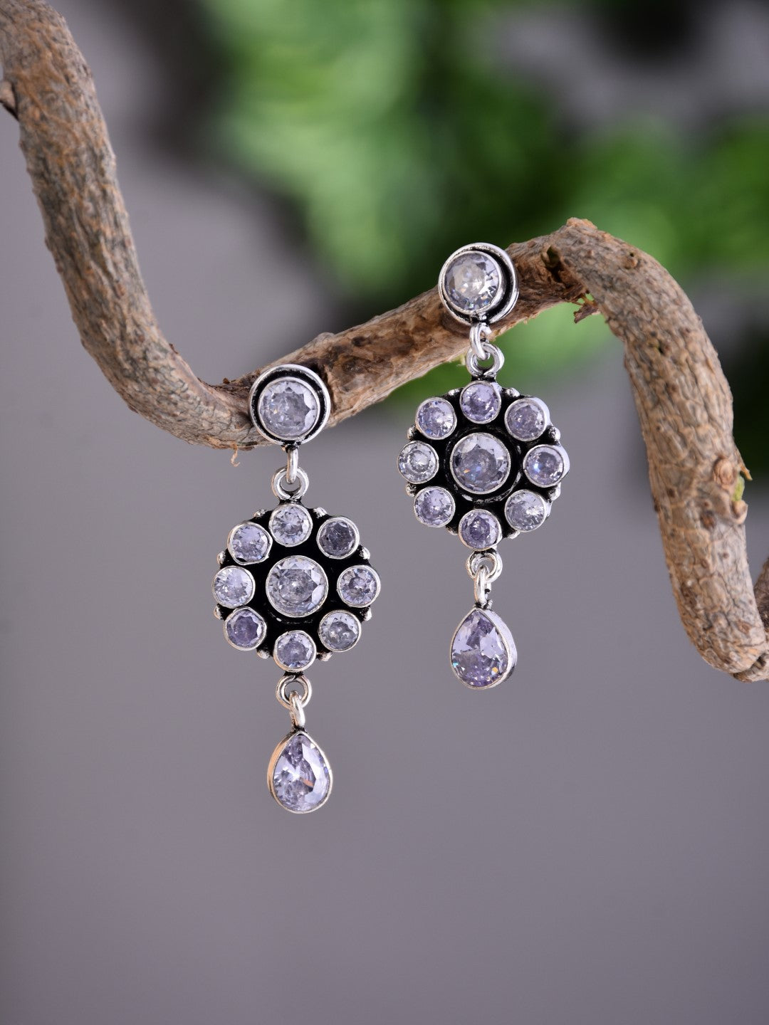 Brass White AD Stone Drop Earrings with Floral & Teardrop Design