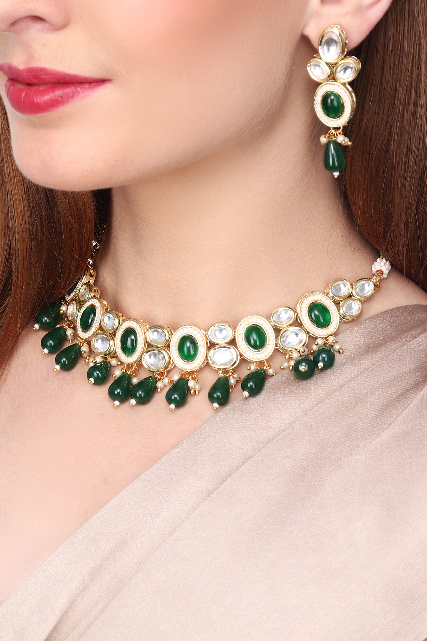 Gold plated Kundan choker set with green stone